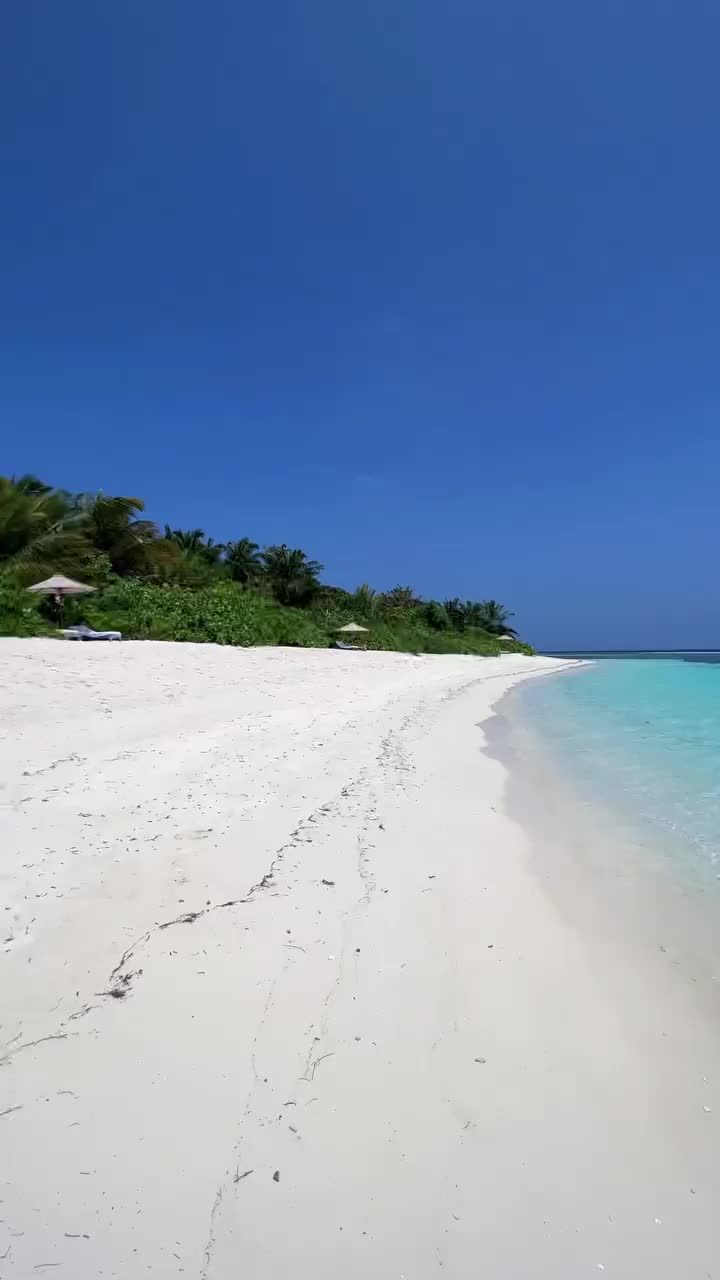 Mid-Day Stroll on White-Sand Maldivian Beach