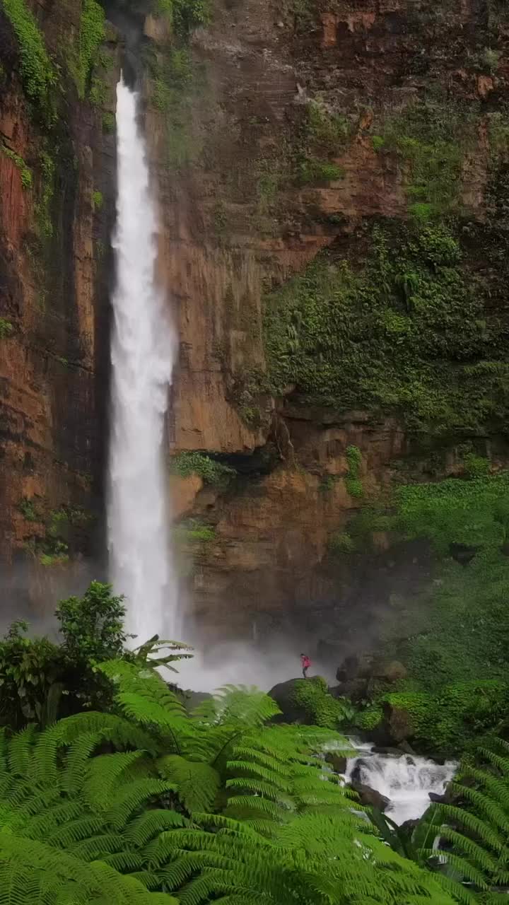 Majestic Kapas Biru Waterfall in Pronojiwo, Indonesia