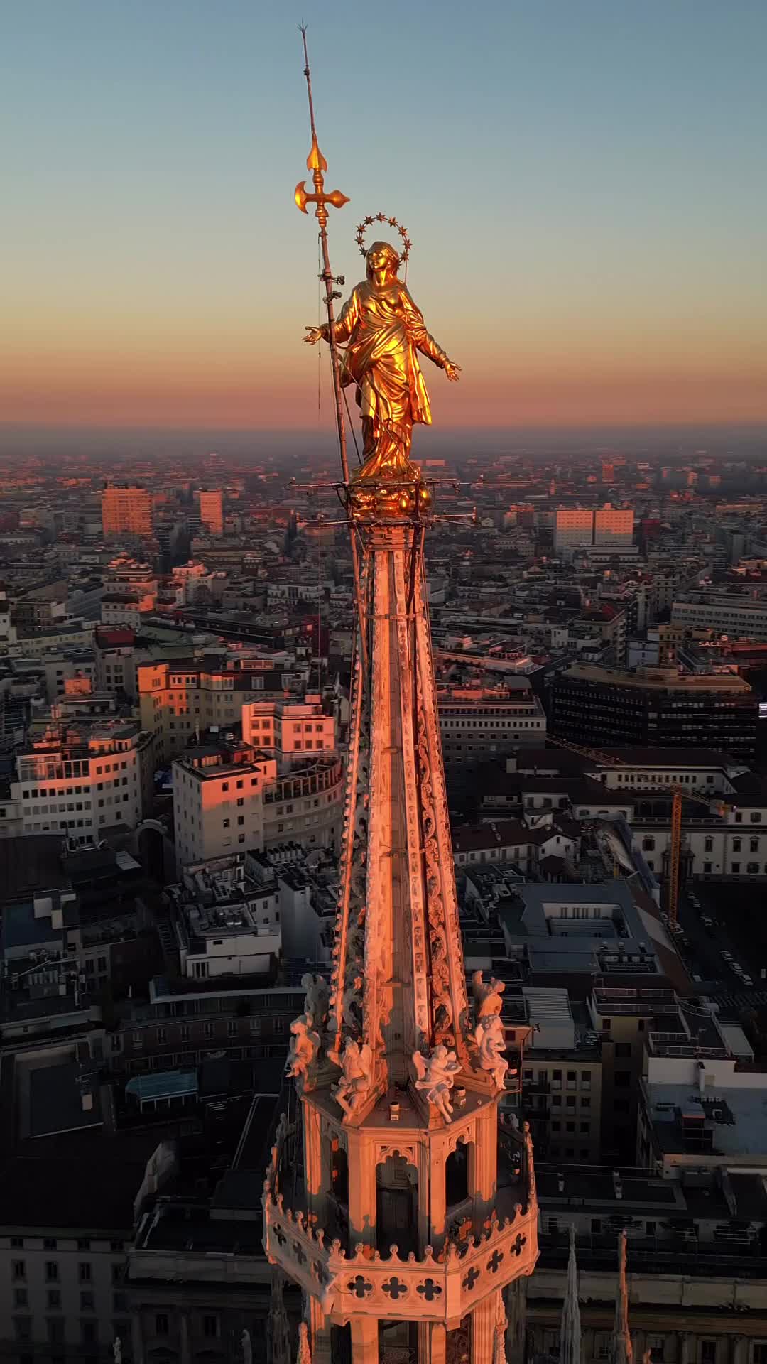 Madonnina Rises Above Milan's Skyline at Sunset