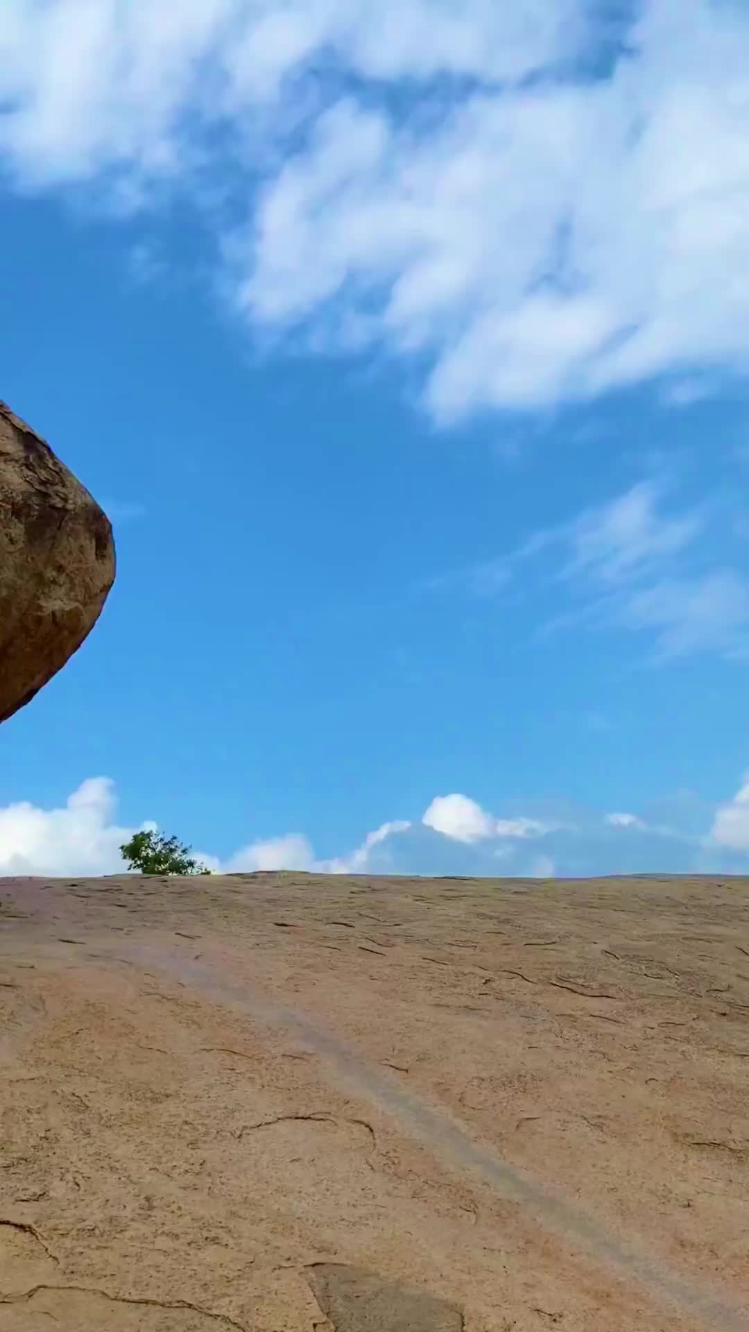 Save it for later! 🇮🇳 A massive boulder that defies gravity! 
Unmoved, on a steep slope. 
It has stood the test of time through tsunamis, earthquakes and cyclones. You can find this massive unique boulder in Mahabalipuram, Tamil Nadu, along with a few other ancient 7th century historical monuments around the boulder.  Add it to your bucket list ✅ 
Do you think the boulder will ever move? Tell me in the comments
.
Krishna’s Butterball, Mahabalipuram 
.
.
@mojindia 
.
#mahabalipuram #tamilnadu #india #apytravels #tamil #travelblogger #travel #monument #boulder #hiddengems #travelindia #southindia