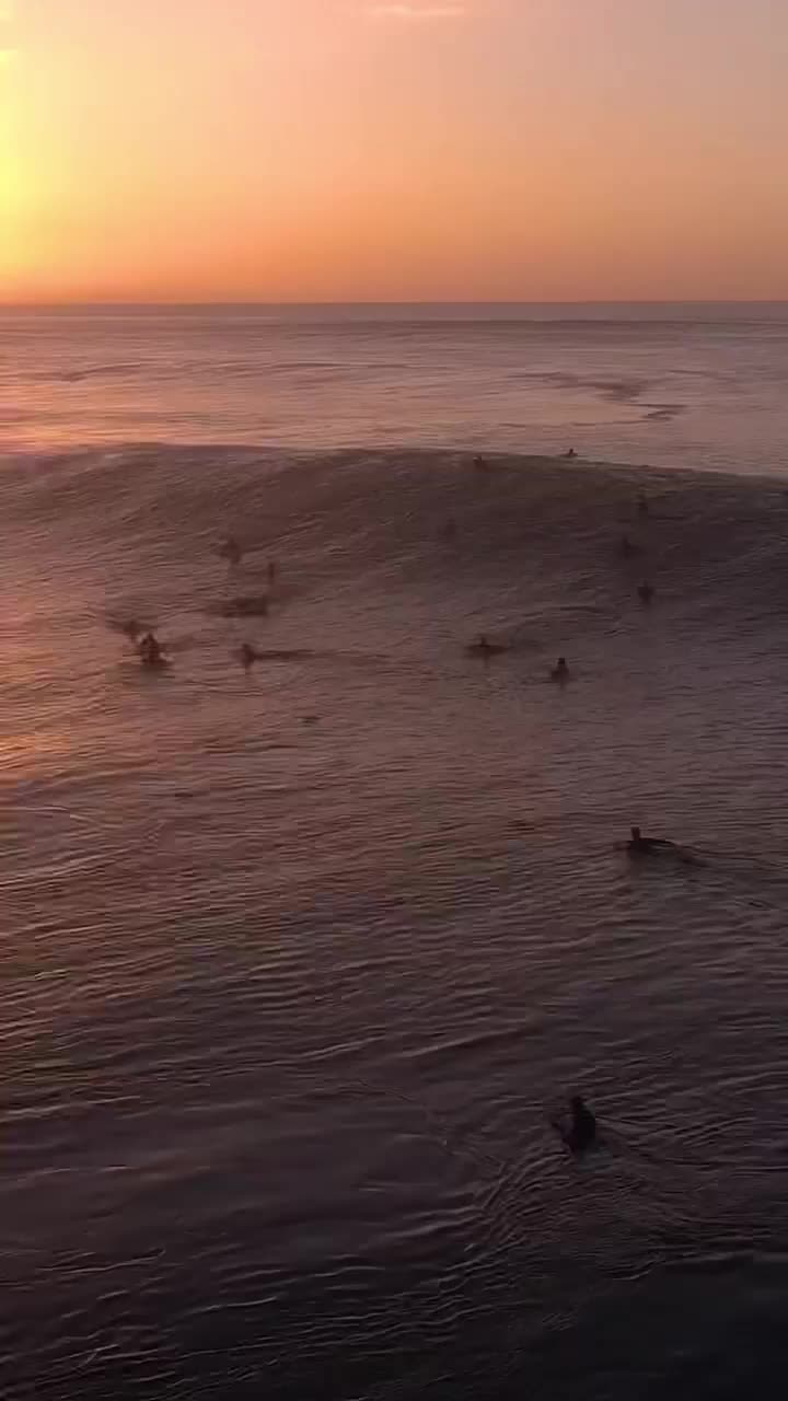 Surfing at Sunset: Epic Banzai Pipeline Barrel Ride